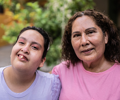 two hispanic women posing for photo