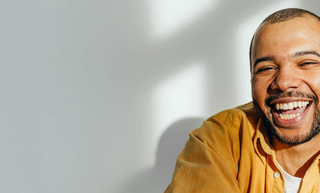 mental health counseling banner image - african american man smiling