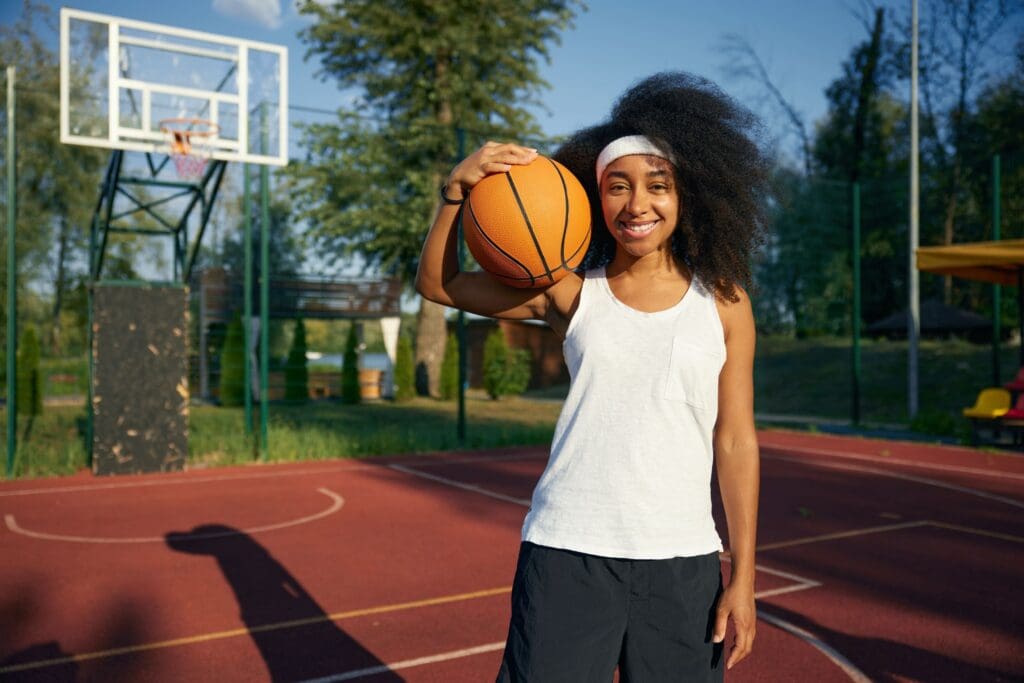 You girl holding basketball