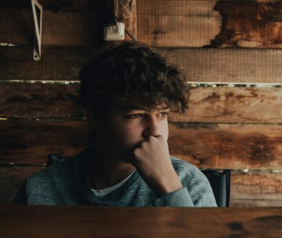 young white male looking sad off into the distance