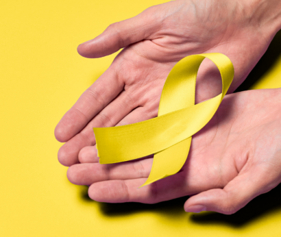 Suicide Prevention Month - Hampton Roads. Hands holding a yellow ribbon